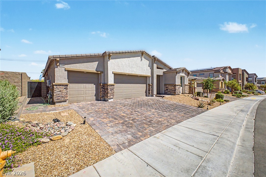 226 Augusta Ridge Henderson, NV 89015 - Photo 5 of 47 This residence showcases a clean architectural facade with practical parking solutions.