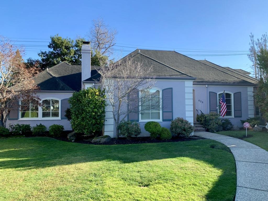 a front view of a house with garden