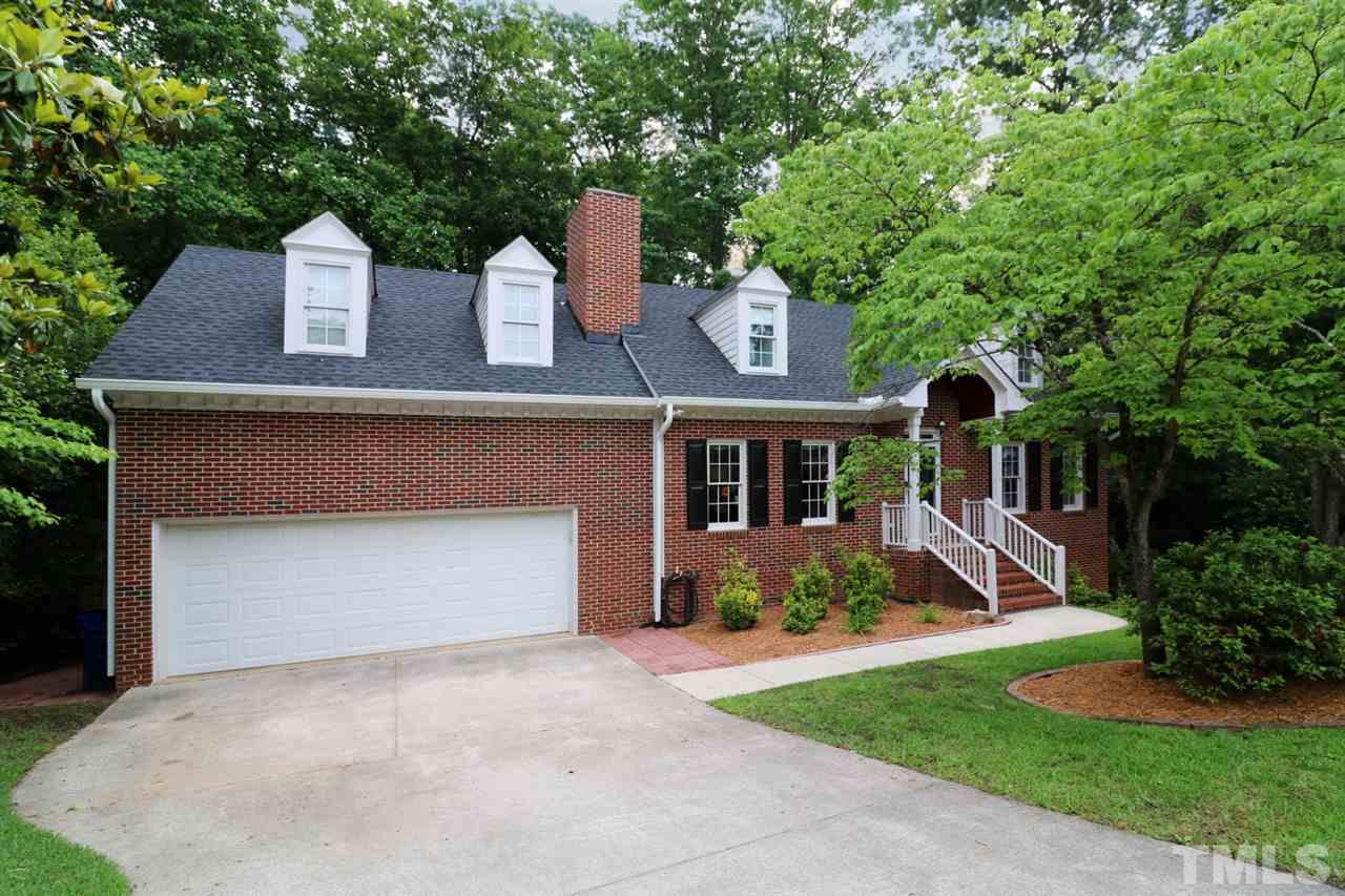 1500 Pecore Place Raleigh, NC 27615 - Photo 2 of 25 a front view of a house with a yard and garage