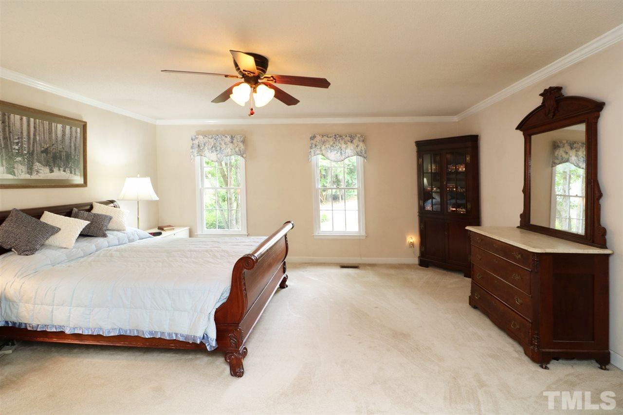1500 Pecore Place Raleigh, NC 27615 - Photo 11 of 25 a bedroom with a bed window and dresser
