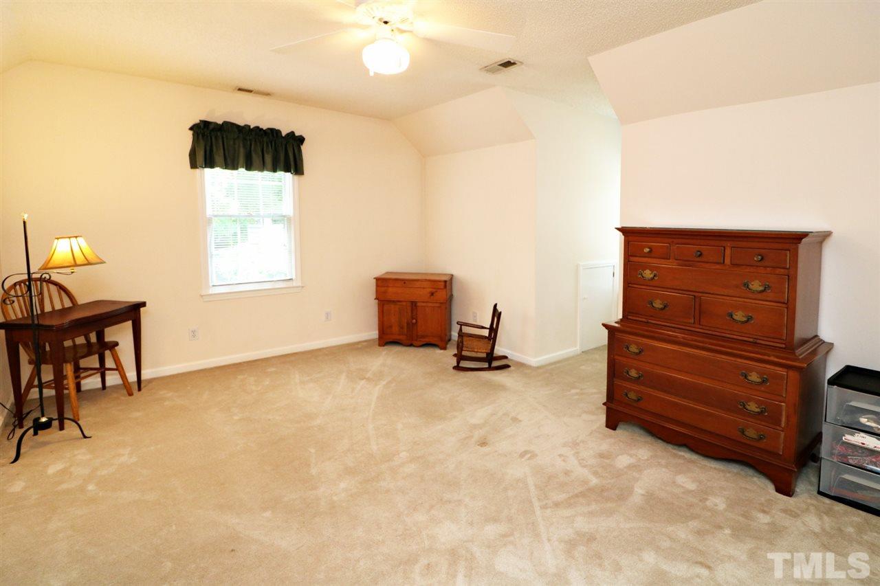1500 Pecore Place Raleigh, NC 27615 - Photo 18 of 25 a view of a livingroom with furniture and a flat screen tv