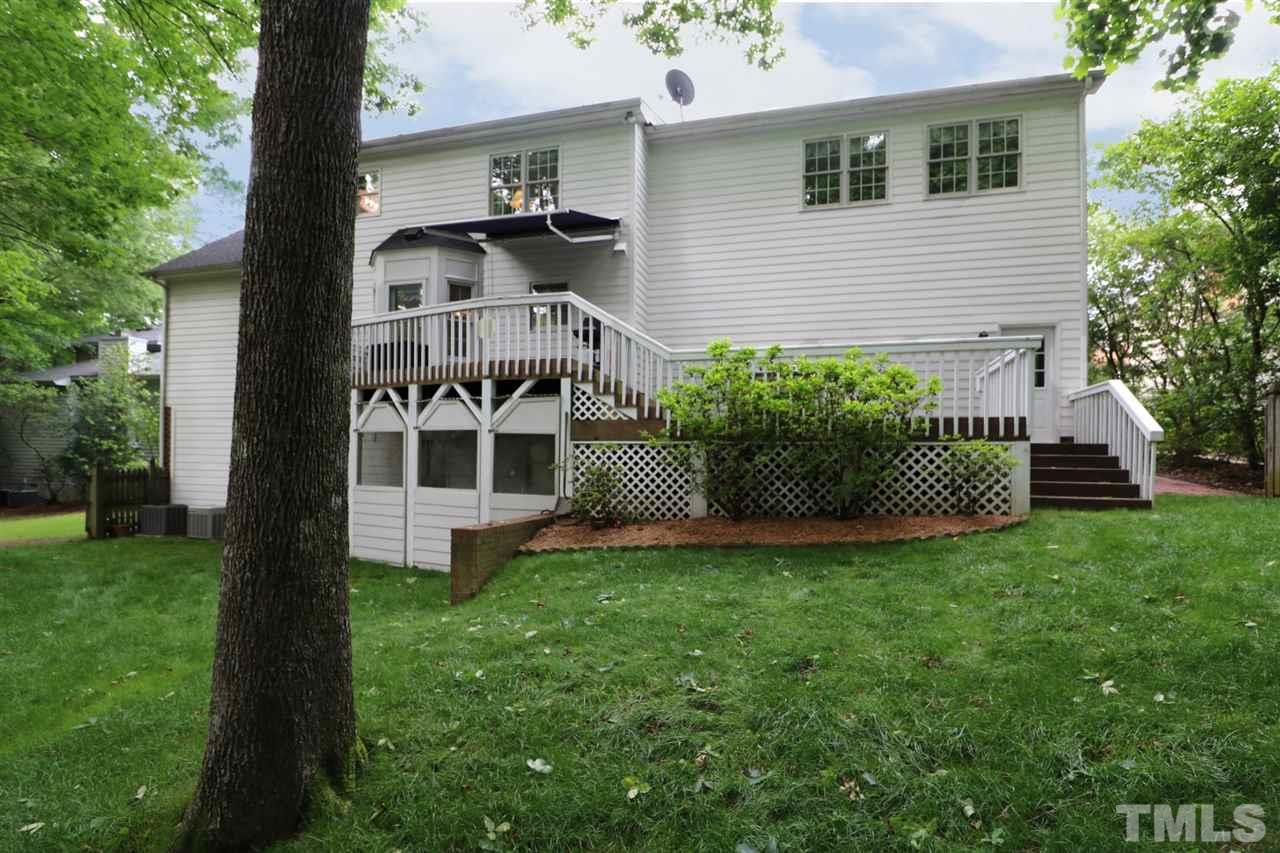 1500 Pecore Place Raleigh, NC 27615 - Photo 23 of 25 a front view of a house with a garden and plants