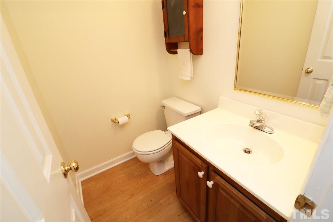 1500 Pecore Place Raleigh, NC 27615 - Photo 9 of 25 a bathroom with a sink and a toilet