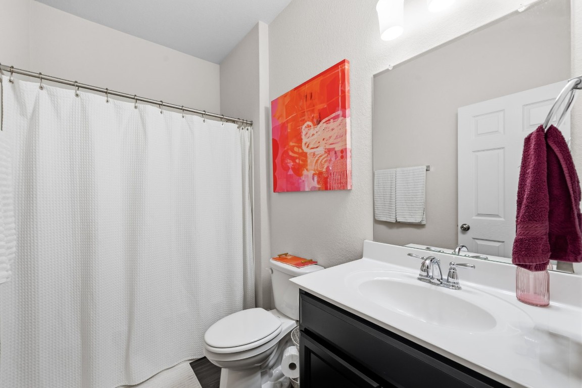 4041 Timber Sapp Drive Conroe, TX 77304 - Photo 12 of 14 a bathroom with a sink and a mirror