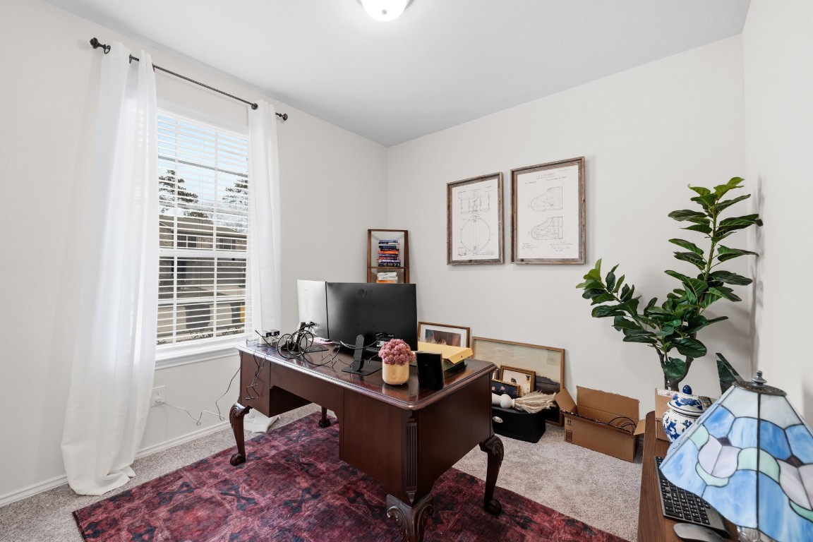 4041 Timber Sapp Drive Conroe, TX 77304 - Photo 2 of 14 a living room with furniture plant and a window