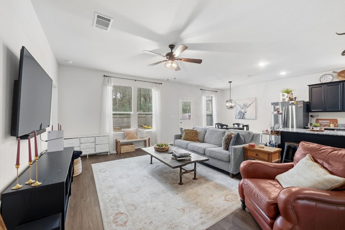 4041 Timber Sapp Drive Conroe, TX 77304 - Photo 3 of 14 a living room with furniture and a flat screen tv