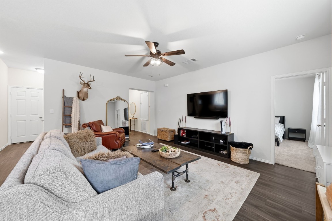 4041 Timber Sapp Drive Conroe, TX 77304 - Photo 4 of 14 a living room with furniture and a flat screen tv