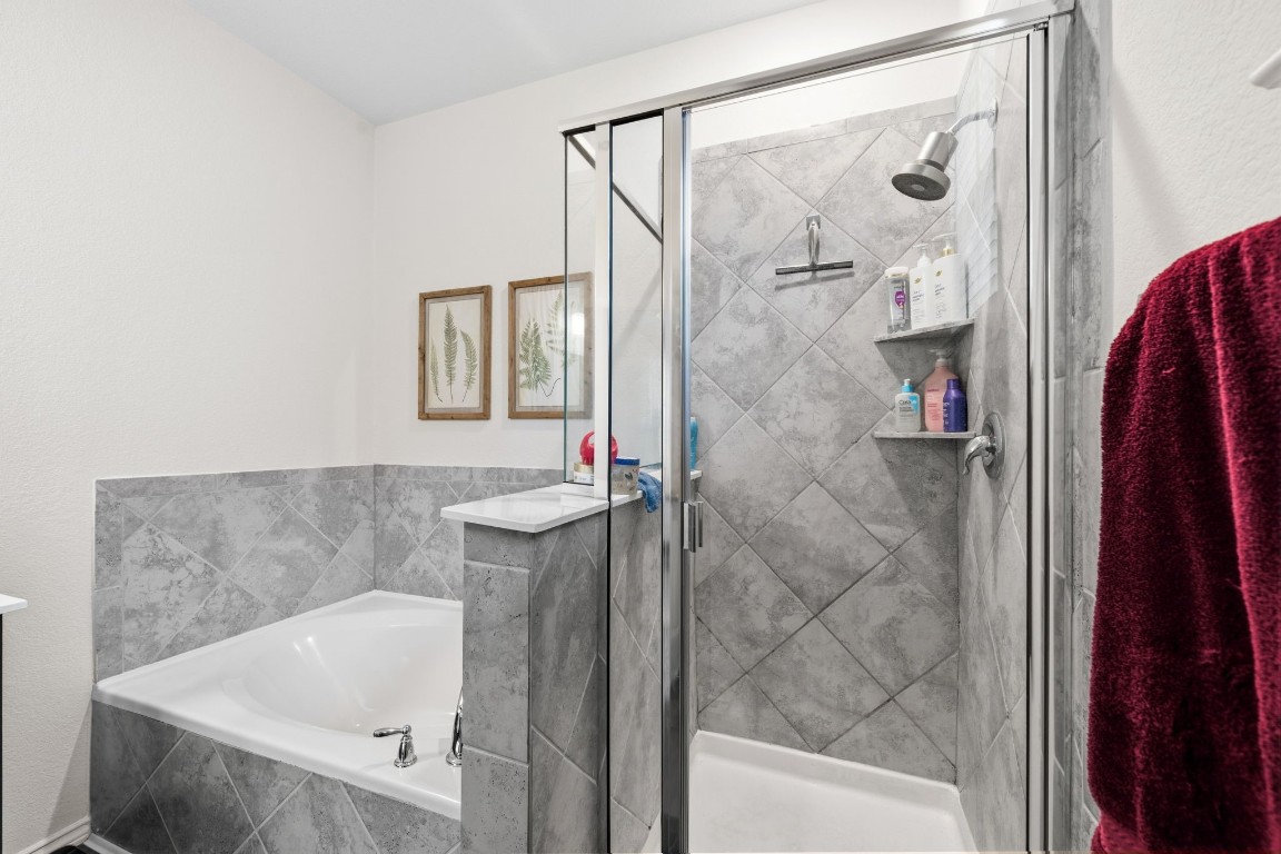 4041 Timber Sapp Drive Conroe, TX 77304 - Photo 10 of 14 a bathroom with a tub and shower