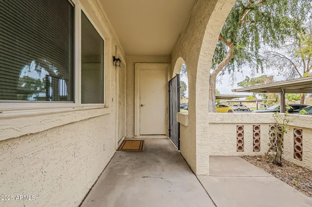 a view of a swimming pool with an outdoor space and seating area