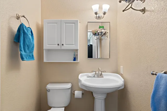 a bathroom with a shower and a mirror