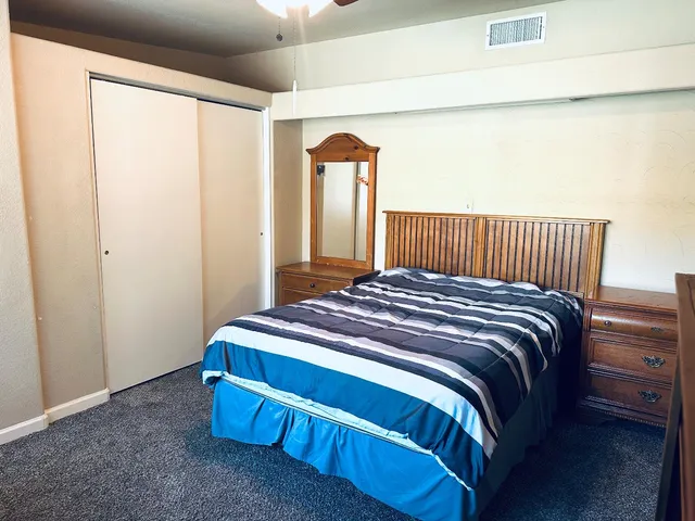 a view of a backyard with sitting area