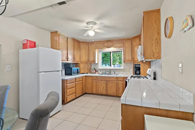 a kitchen with a sink and a window