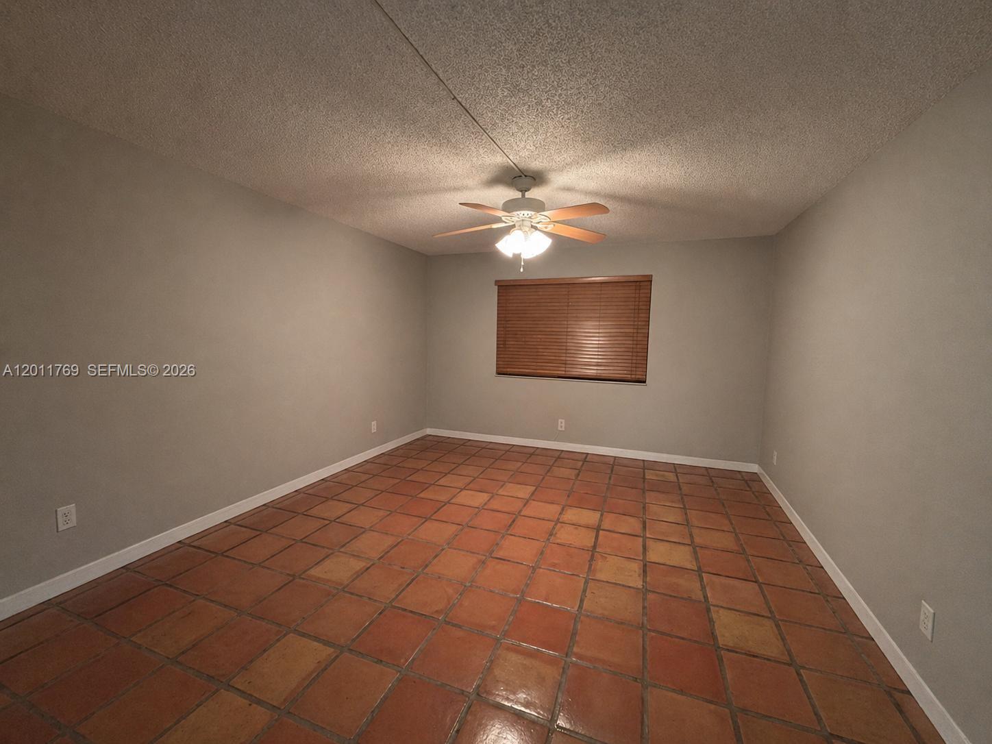 286 Racquet Club Road, Unit 204 Weston, FL 33326 - Photo 7 of 11 a view of an empty room and chandelier fan