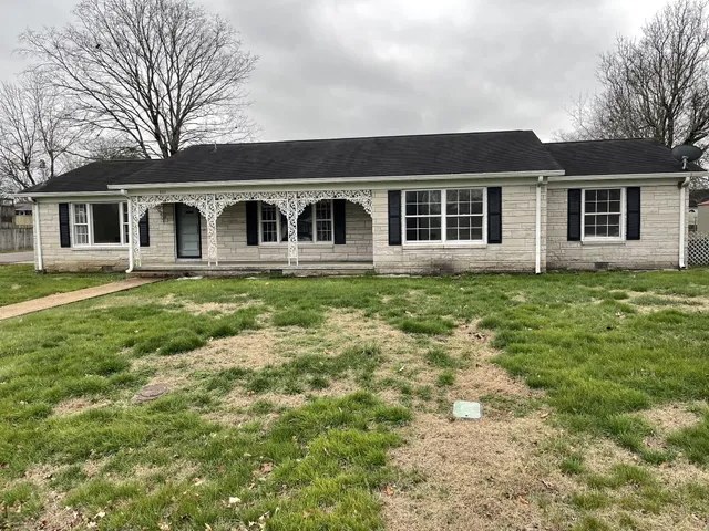 front view of a house with a yard