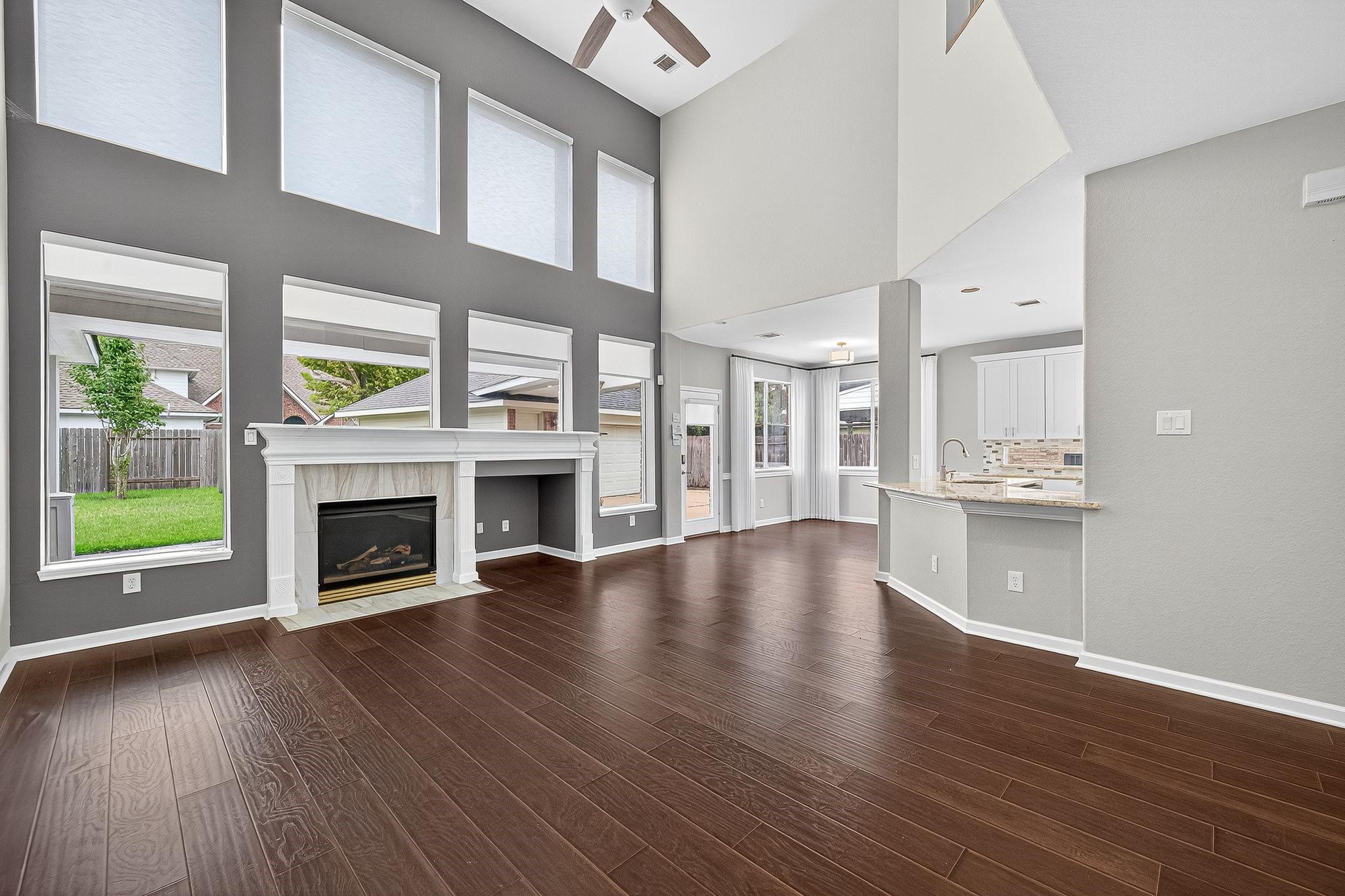 22406 Piper Terrace Lane Katy, TX 77450 - Photo 13 of 44 a view of an empty room with a fireplace and a window