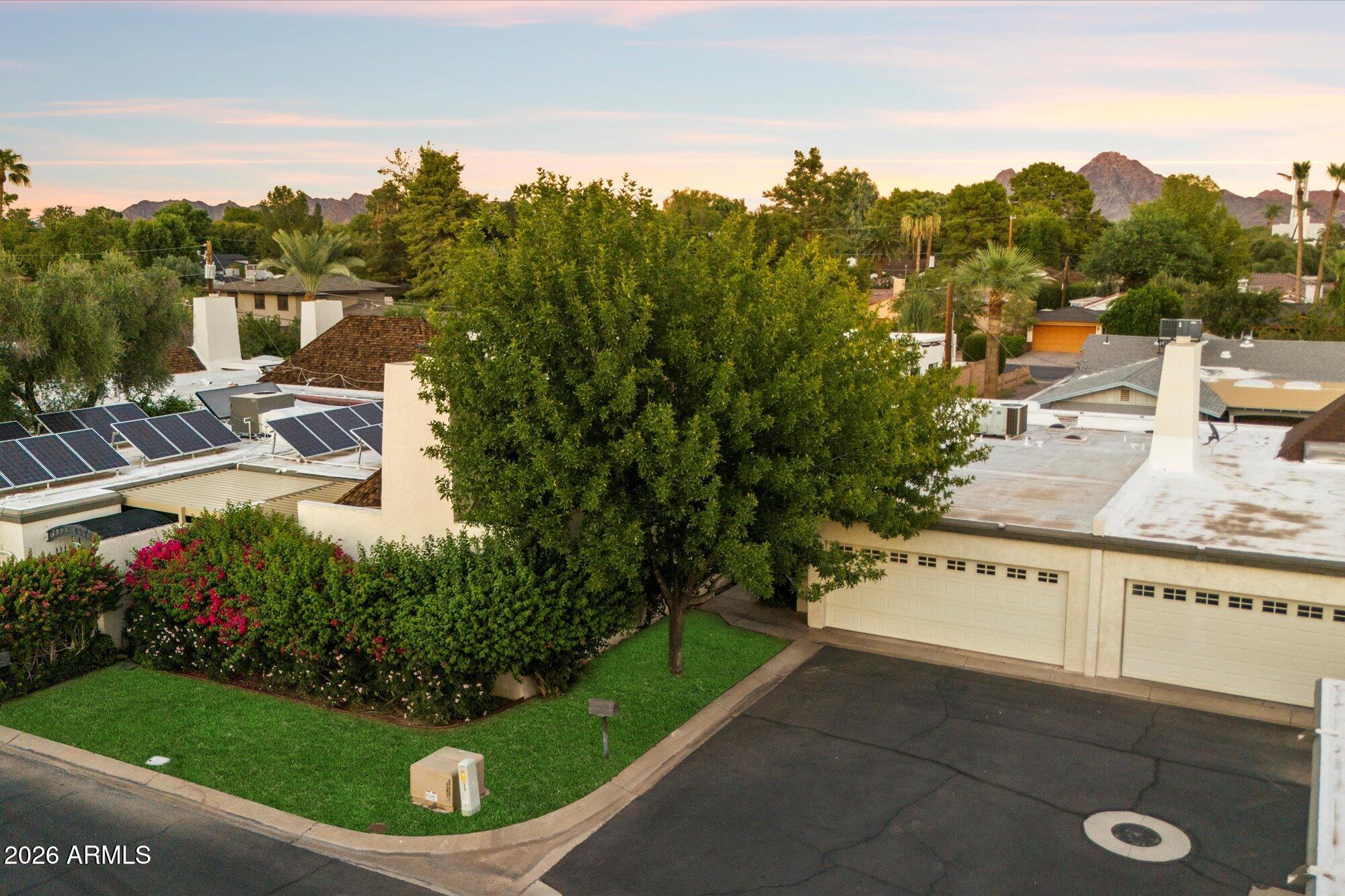 7005 North Barbados Place Phoenix, AZ 85021 - Photo 2 of 42 a view of a terrace with a garden and trees