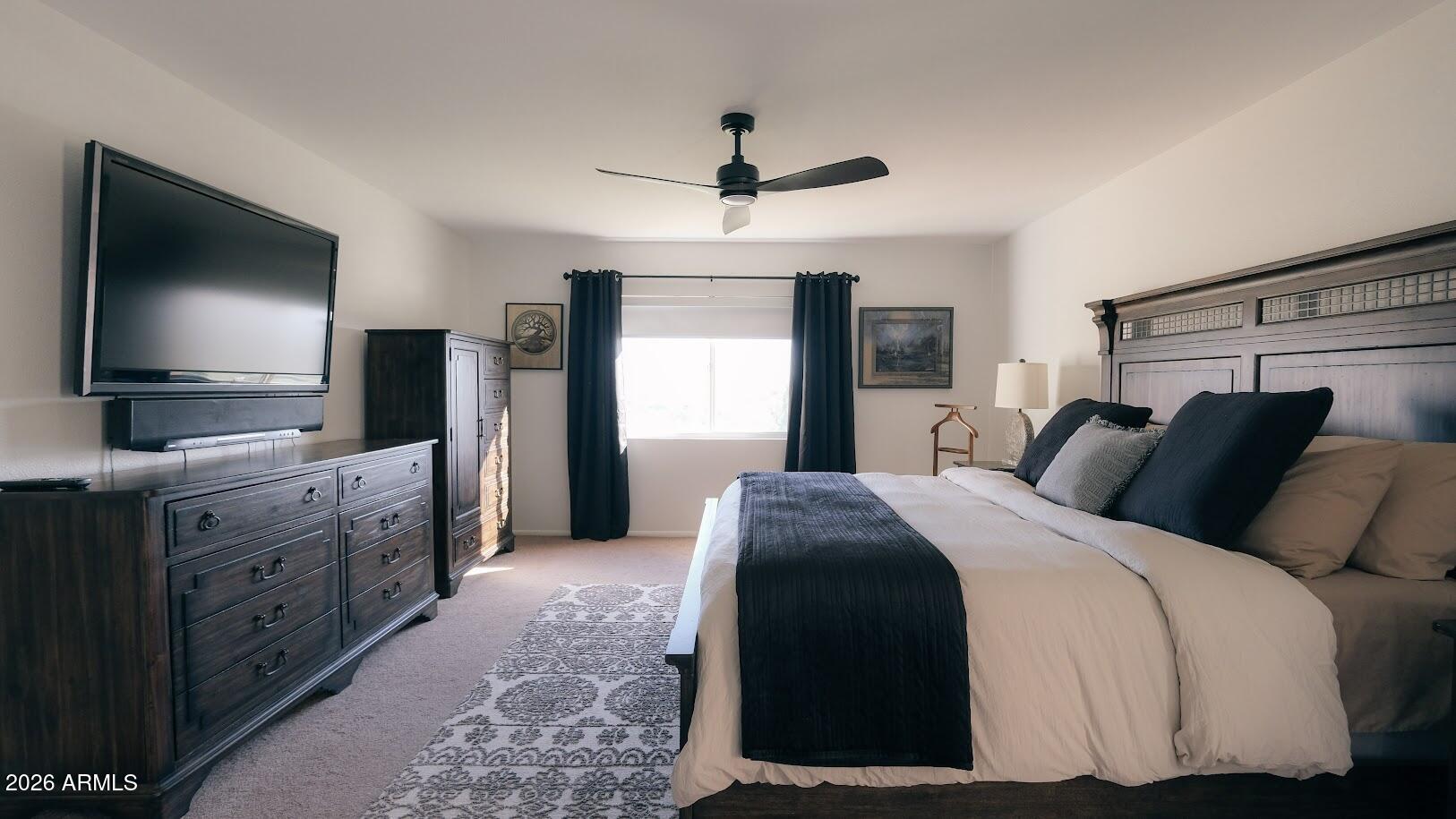 7940 East Camelback Road, Unit 608 Scottsdale, AZ 85251 - Photo 14 of 45 a bedroom with a large bed and a flat tv screen on dresser