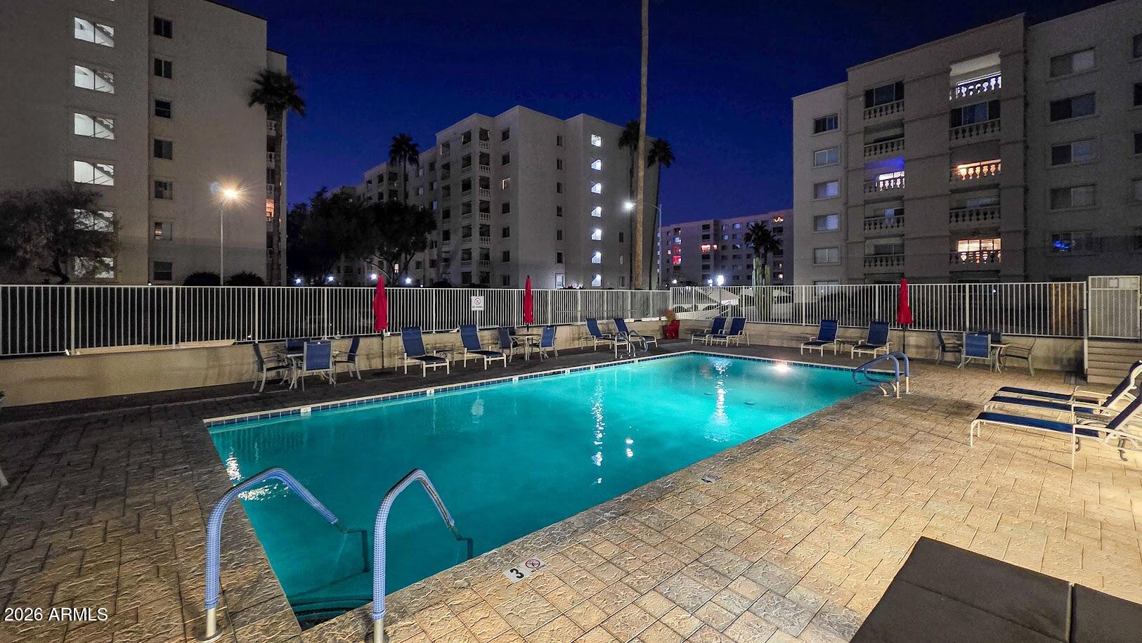7940 East Camelback Road, Unit 608 Scottsdale, AZ 85251 - Photo 2 of 45 a view of a swimming pool with outdoor seating