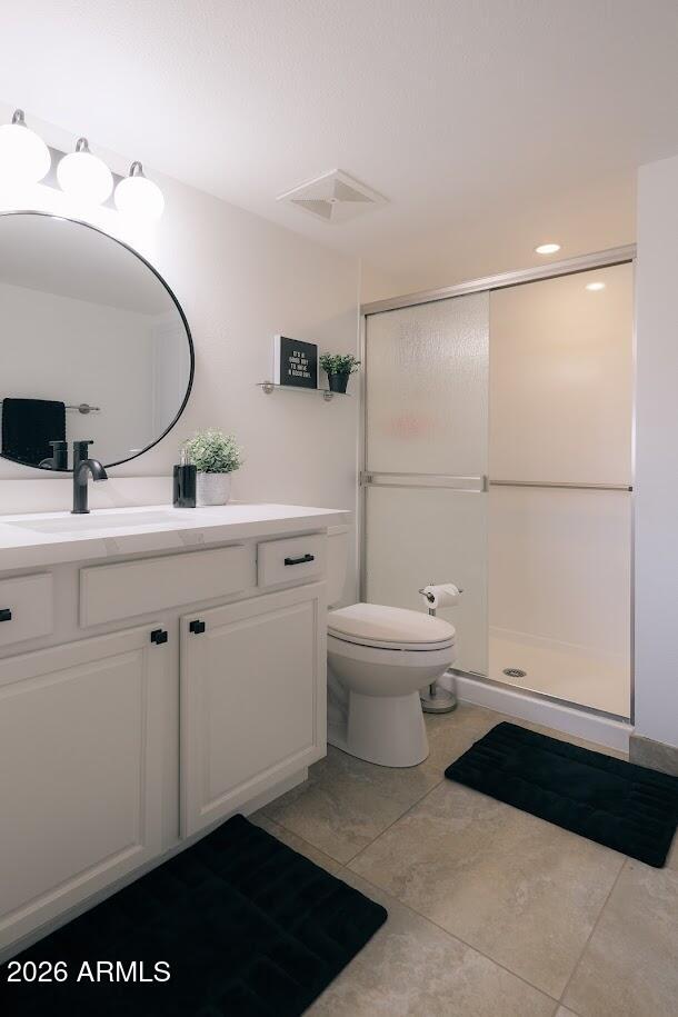 7940 East Camelback Road, Unit 608 Scottsdale, AZ 85251 - Photo 21 of 45 a bathroom with a sink a toilet and a mirror