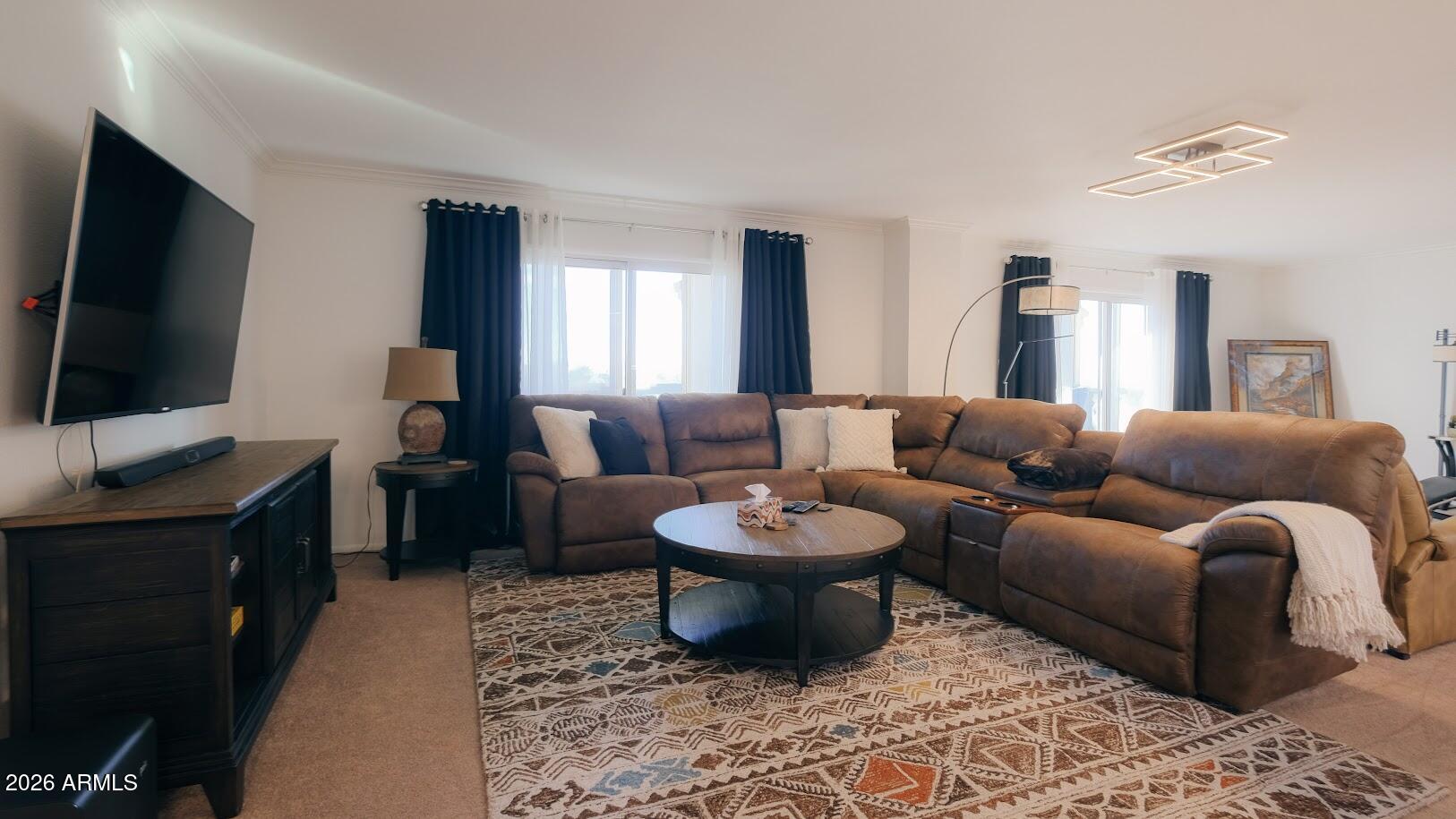 7940 East Camelback Road, Unit 608 Scottsdale, AZ 85251 - Photo 3 of 45 a living room with furniture and a flat screen tv