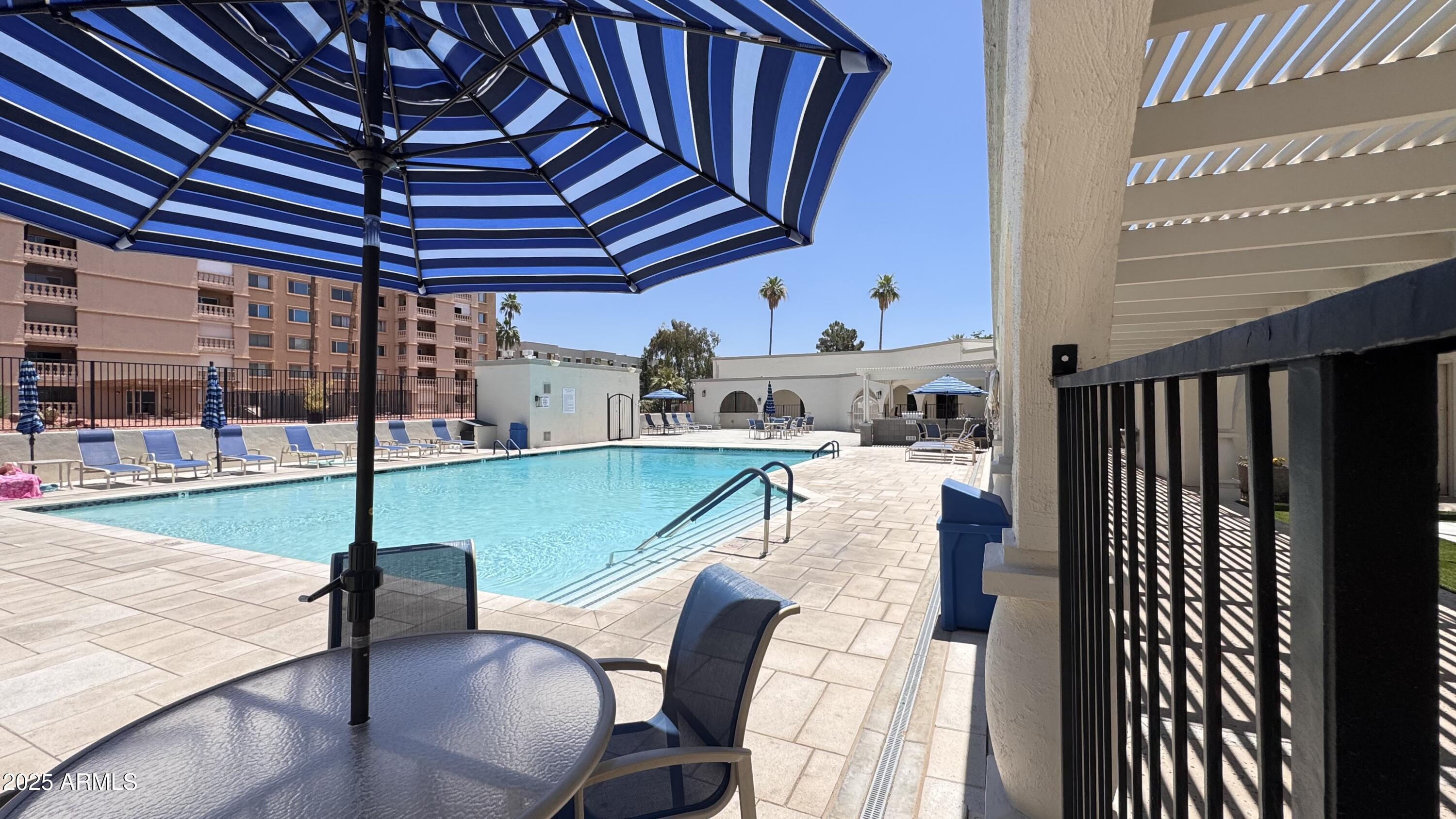 7940 East Camelback Road, Unit 608 Scottsdale, AZ 85251 - Photo 35 of 45 a view of swimming pool from a patio