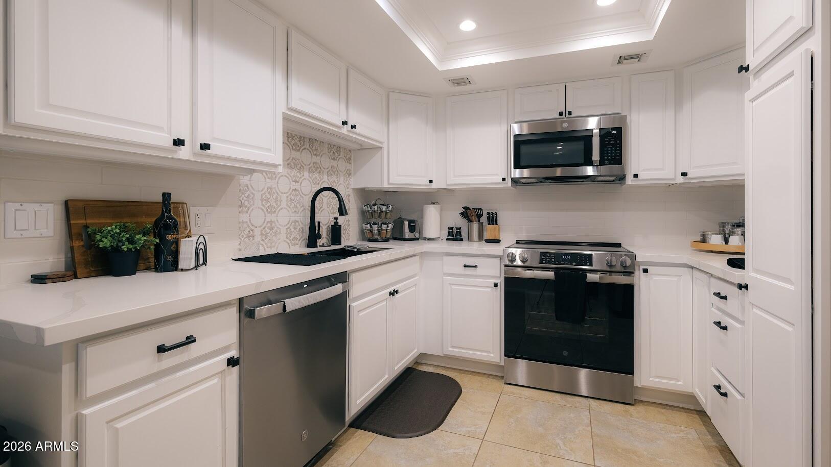7940 East Camelback Road, Unit 608 Scottsdale, AZ 85251 - Photo 4 of 45 a kitchen with a sink and stainless steel appliances