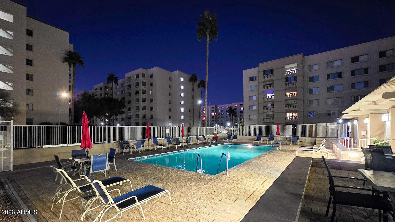 7940 East Camelback Road, Unit 608 Scottsdale, AZ 85251 - Photo 42 of 45 a view of a swimming pool with lounge chairs