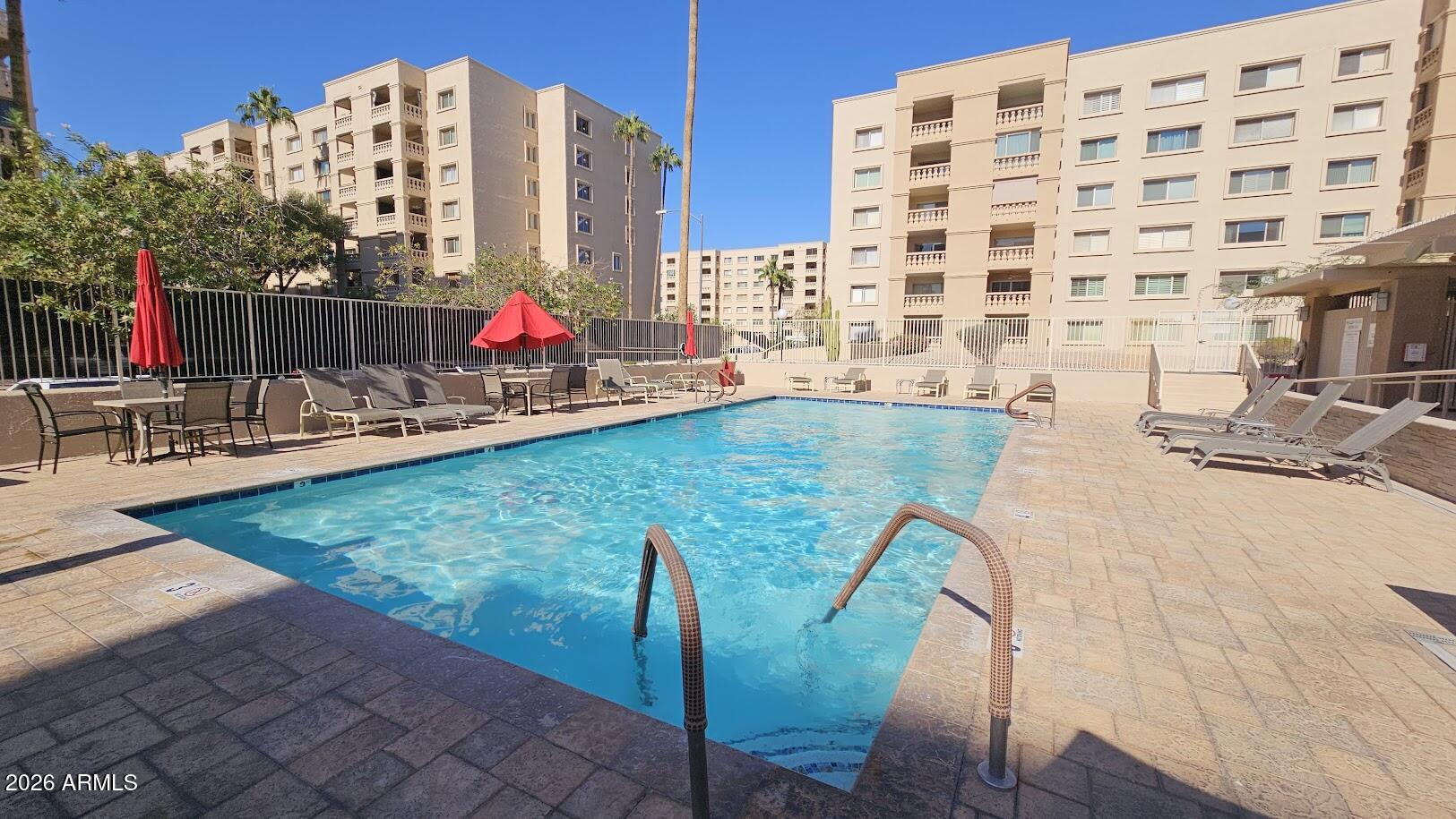 7940 East Camelback Road, Unit 608 Scottsdale, AZ 85251 - Photo 44 of 45 a view of swimming pool with outdoor seating
