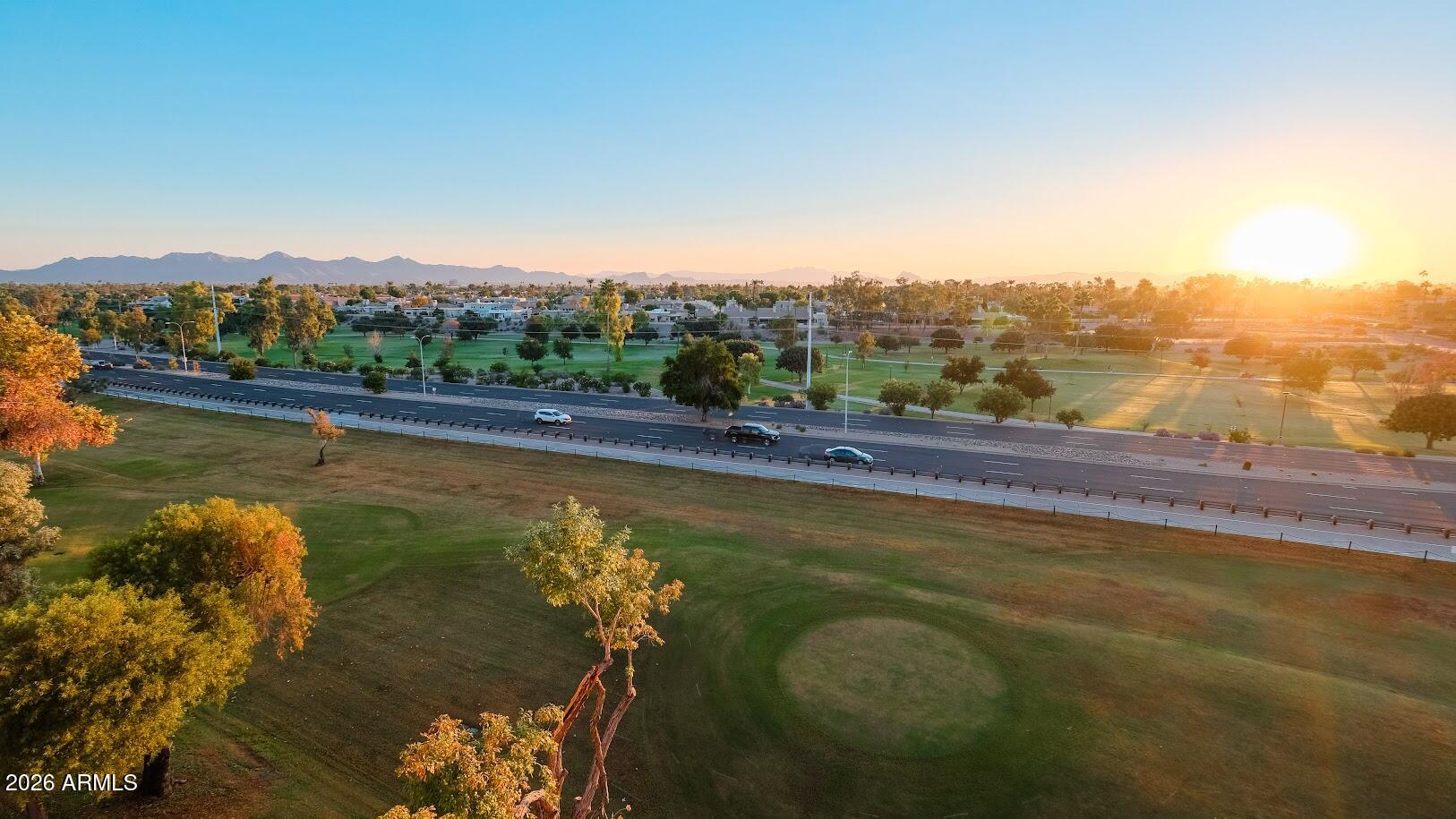 7940 East Camelback Road, Unit 608 Scottsdale, AZ 85251 - Photo 45 of 45 a view of a lake with a mountain in the background