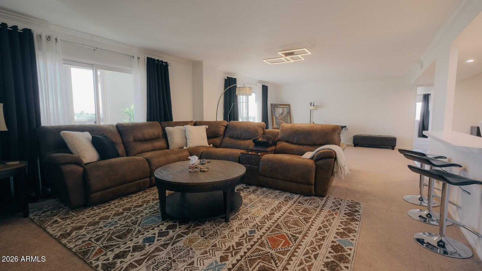 7940 East Camelback Road, Unit 608 Scottsdale, AZ 85251 - Photo 9 of 45 a living room with furniture and a rug