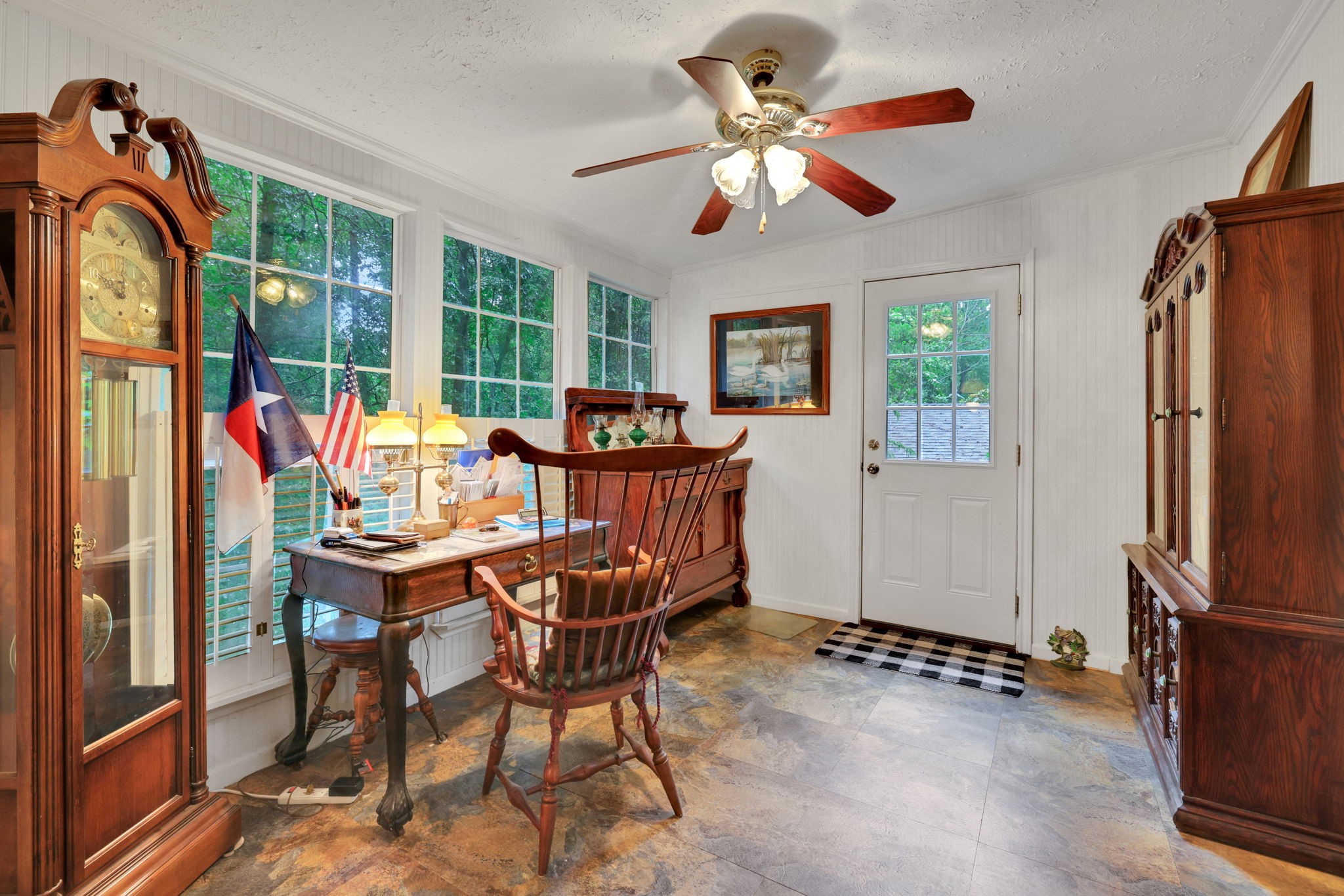 300 Timber Lane Coldspring, TX 77331 - Photo 16 of 43 a dining room with furniture a flat screen tv and a large window