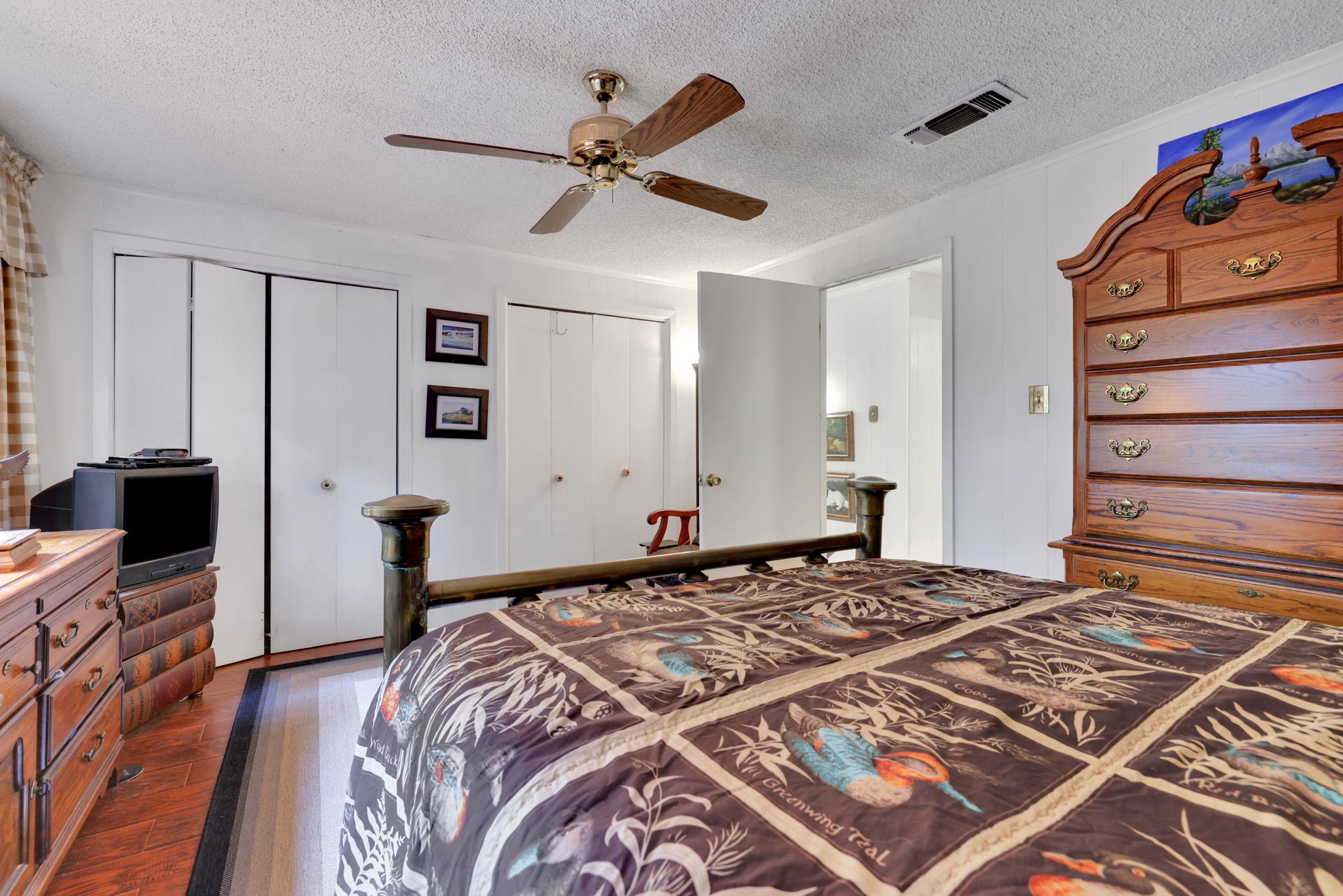 300 Timber Lane Coldspring, TX 77331 - Photo 23 of 43 a bedroom with a bed and a flat screen tv
