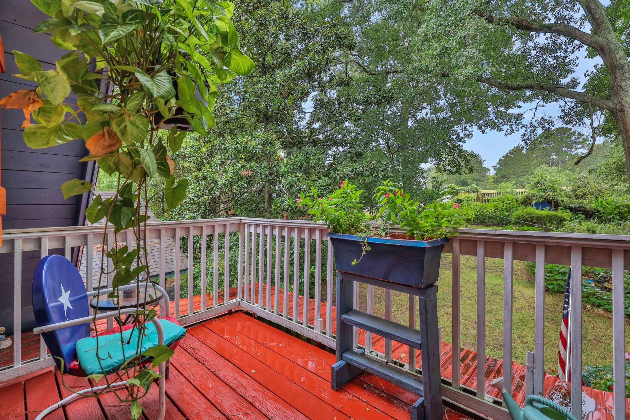 300 Timber Lane Coldspring, TX 77331 - Photo 27 of 43 a balcony with wooden floor and outdoor seating