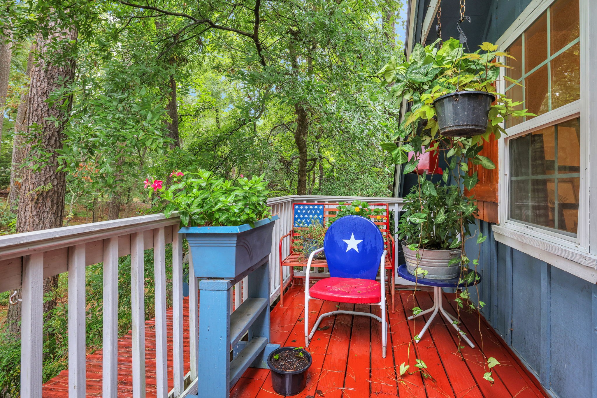 300 Timber Lane Coldspring, TX 77331 - Photo 29 of 43 a wooden bench sitting in front of a building