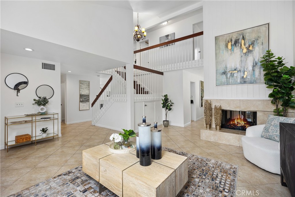 15 Colonial Irvine, CA 92620 - Photo 1 of 42 a living room with furniture and a fireplace