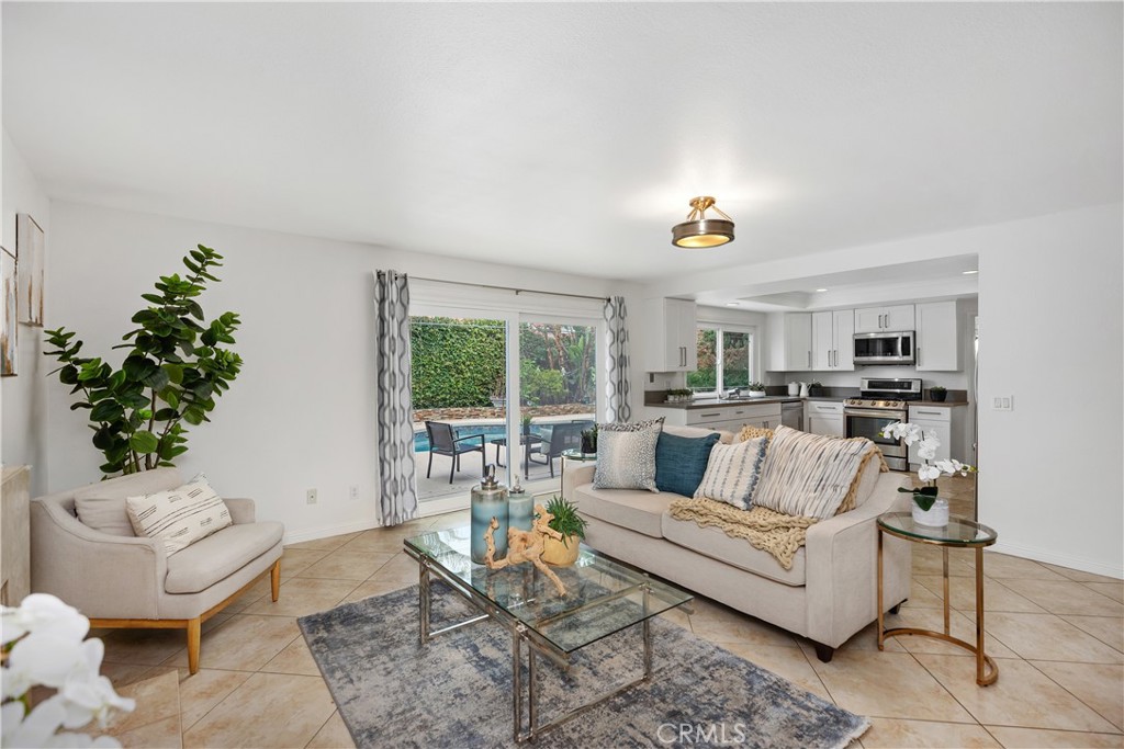 15 Colonial Irvine, CA 92620 - Photo 20 of 42 a living room with furniture and a large window