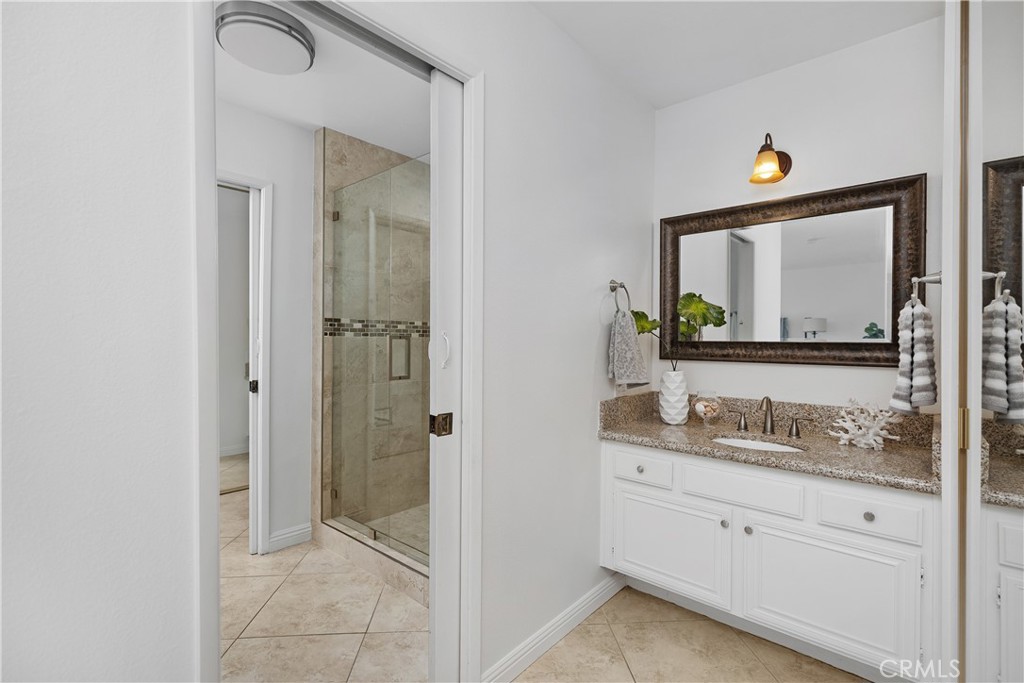 15 Colonial Irvine, CA 92620 - Photo 29 of 42 a bathroom with a sink vanity granite tub and shower