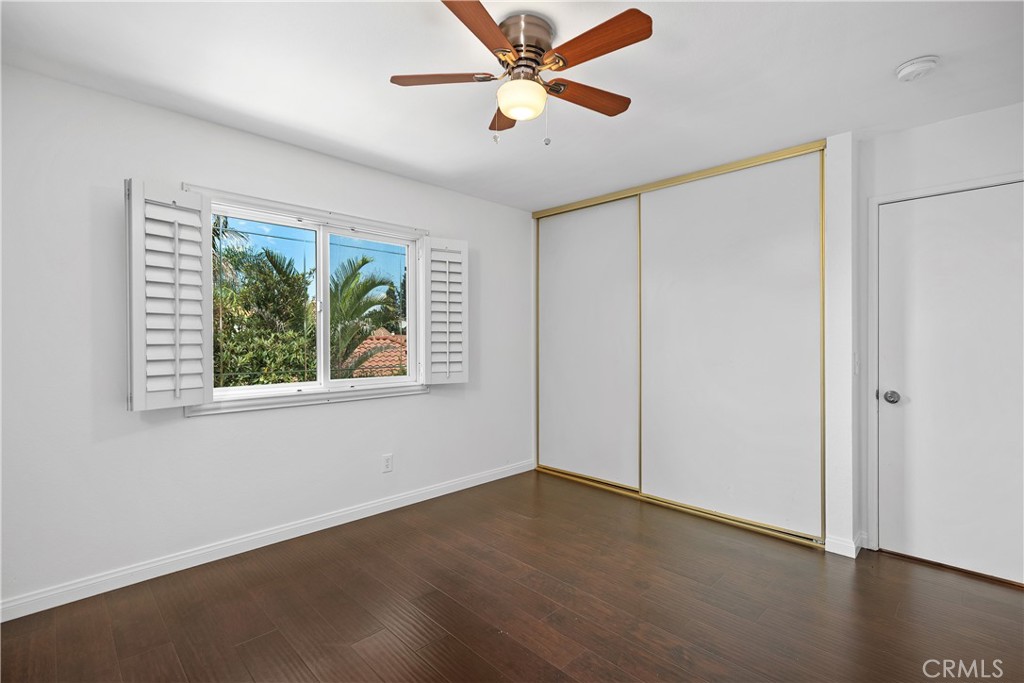 15 Colonial Irvine, CA 92620 - Photo 31 of 42 a view of an empty room with wooden floor and a window