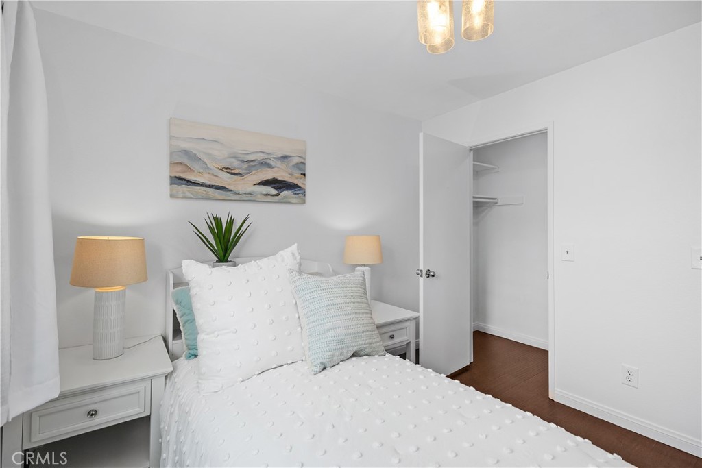 15 Colonial Irvine, CA 92620 - Photo 34 of 42 a bedroom with a bed and a painting on the wall