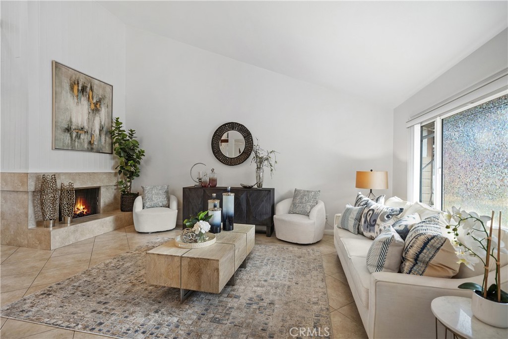 15 Colonial Irvine, CA 92620 - Photo 8 of 42 a living room with furniture and a fireplace