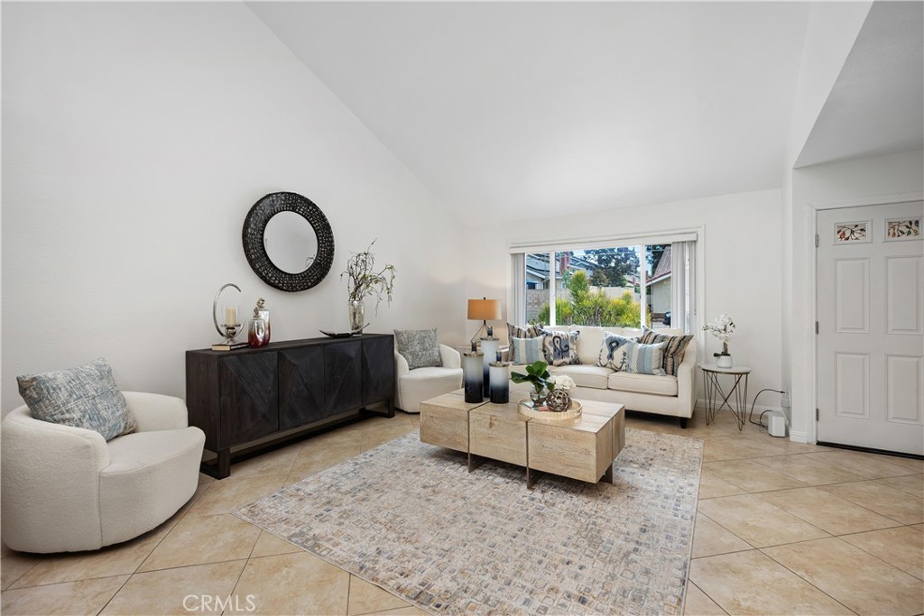 15 Colonial Irvine, CA 92620 - Photo 9 of 42 a living room with furniture a couch and a window