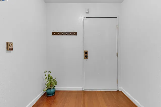 a view of hallway with wooden floor