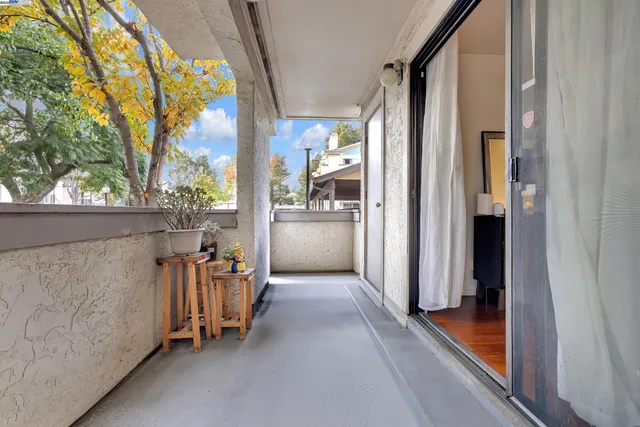 a view of a porch with seating space