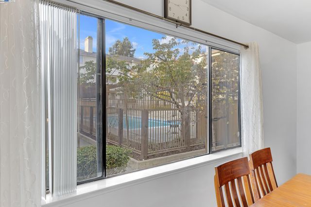 a view of a porch with a floor to ceiling window
