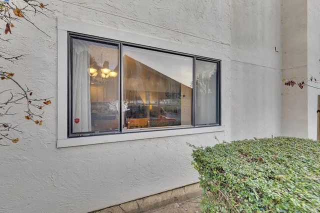 a view of a room that has a large window