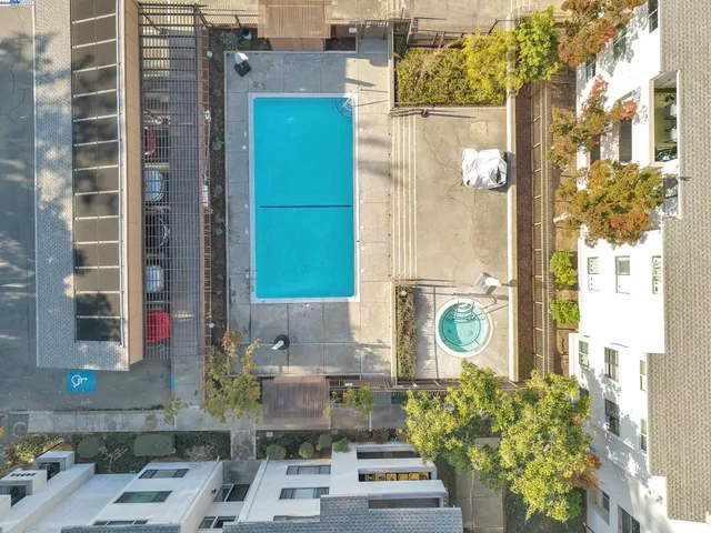 a picture of a bathroom with a shower and a mirror