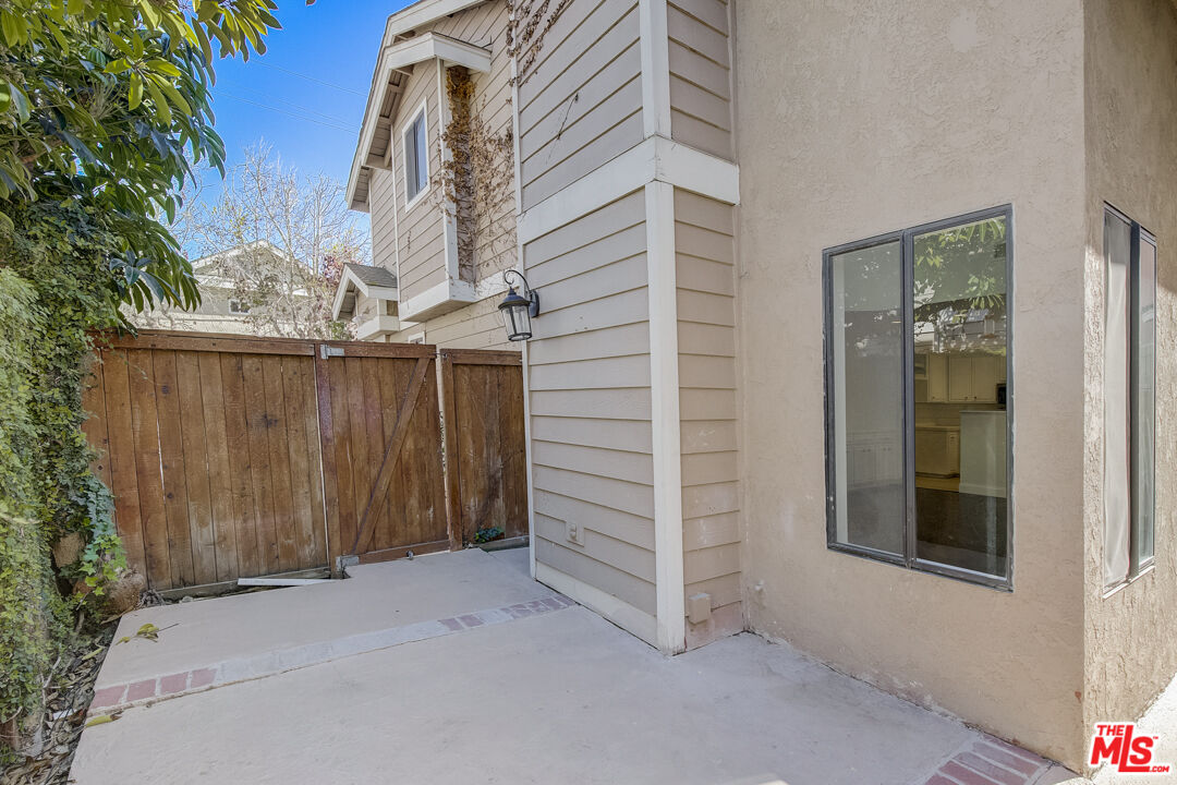 117 East Wilson Street, Unit C Costa Mesa, CA 92627 - Photo 17 of 23 a view of a house with a wooden door