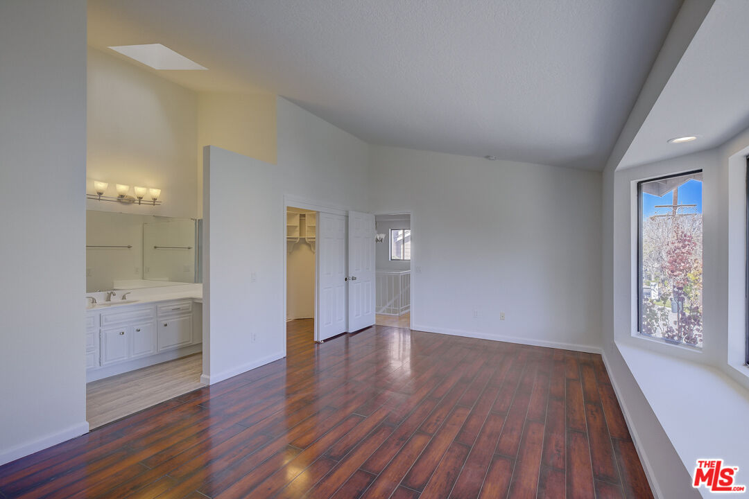 117 East Wilson Street, Unit C Costa Mesa, CA 92627 - Photo 19 of 23 wooden floor in an empty room with a window