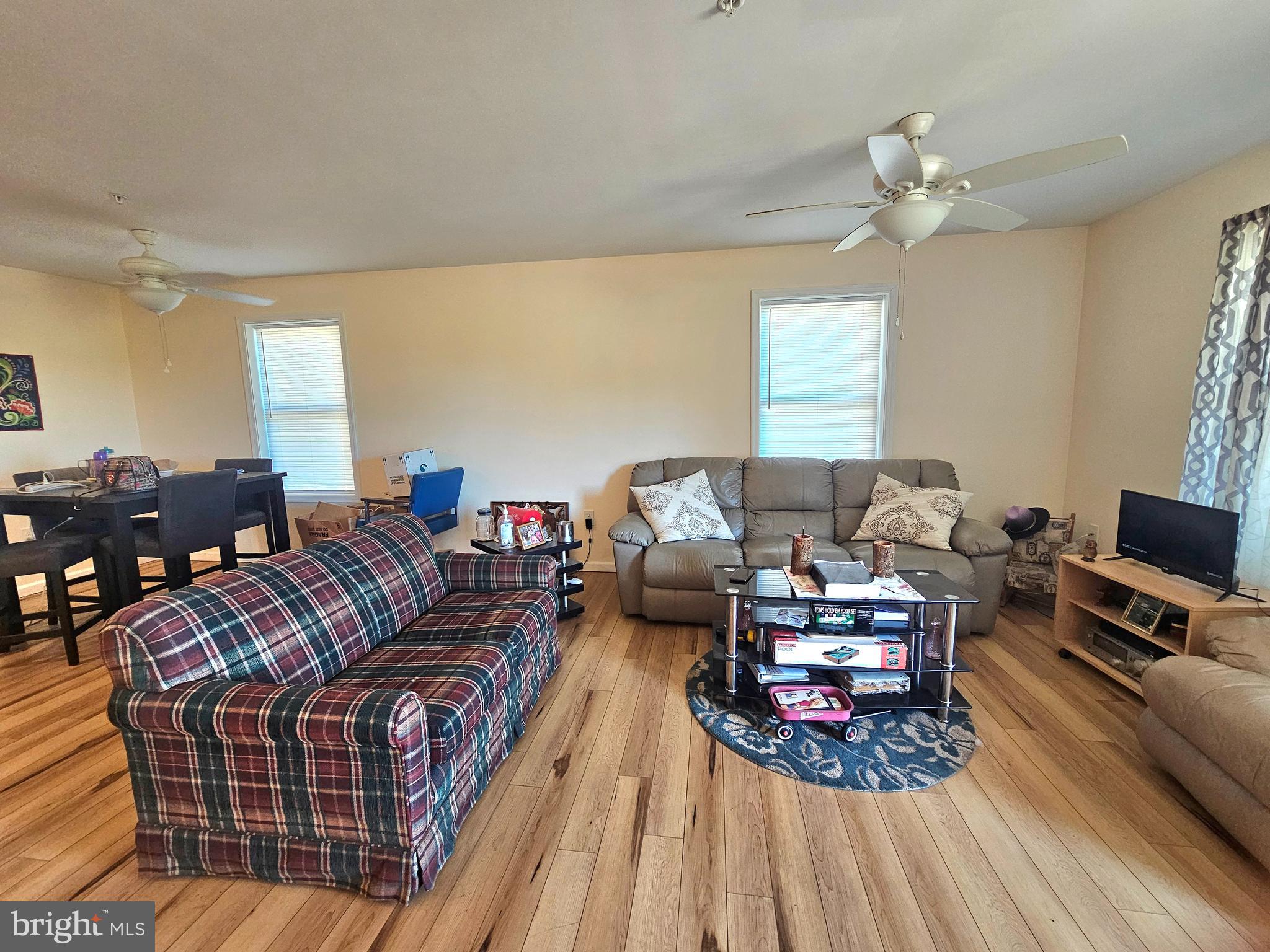 9420 Follow Ditch Road Westover, MD 21871 - Photo 4 of 24 a living room with furniture and a chandelier