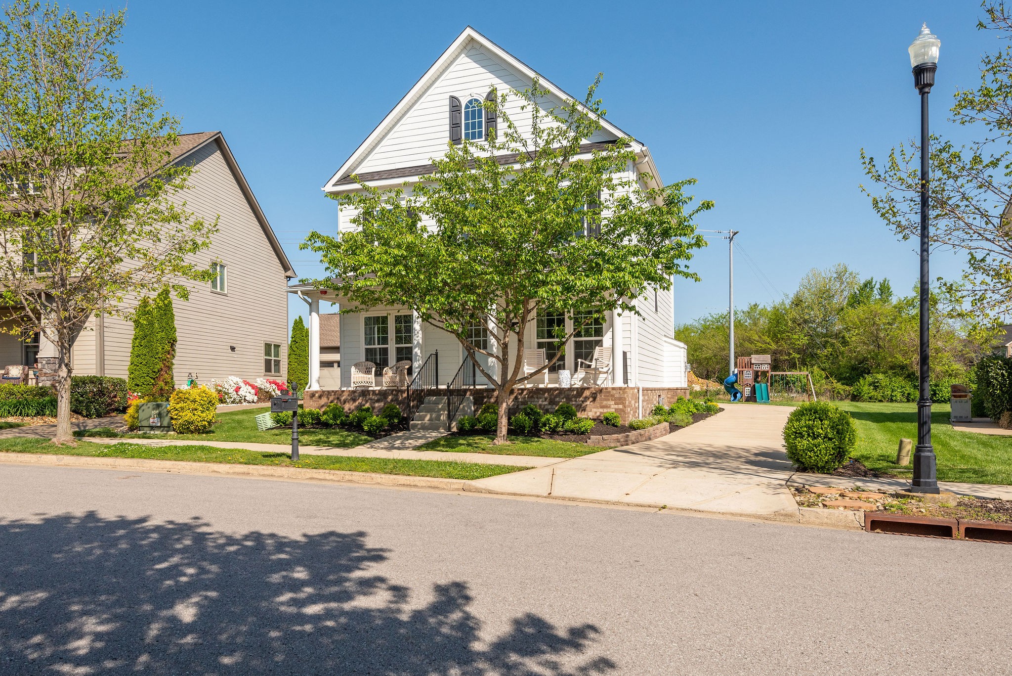 620 Streamside Lane Franklin, TN 37064 - Photo 2 of 45 a front view of a house with a yard and potted plants